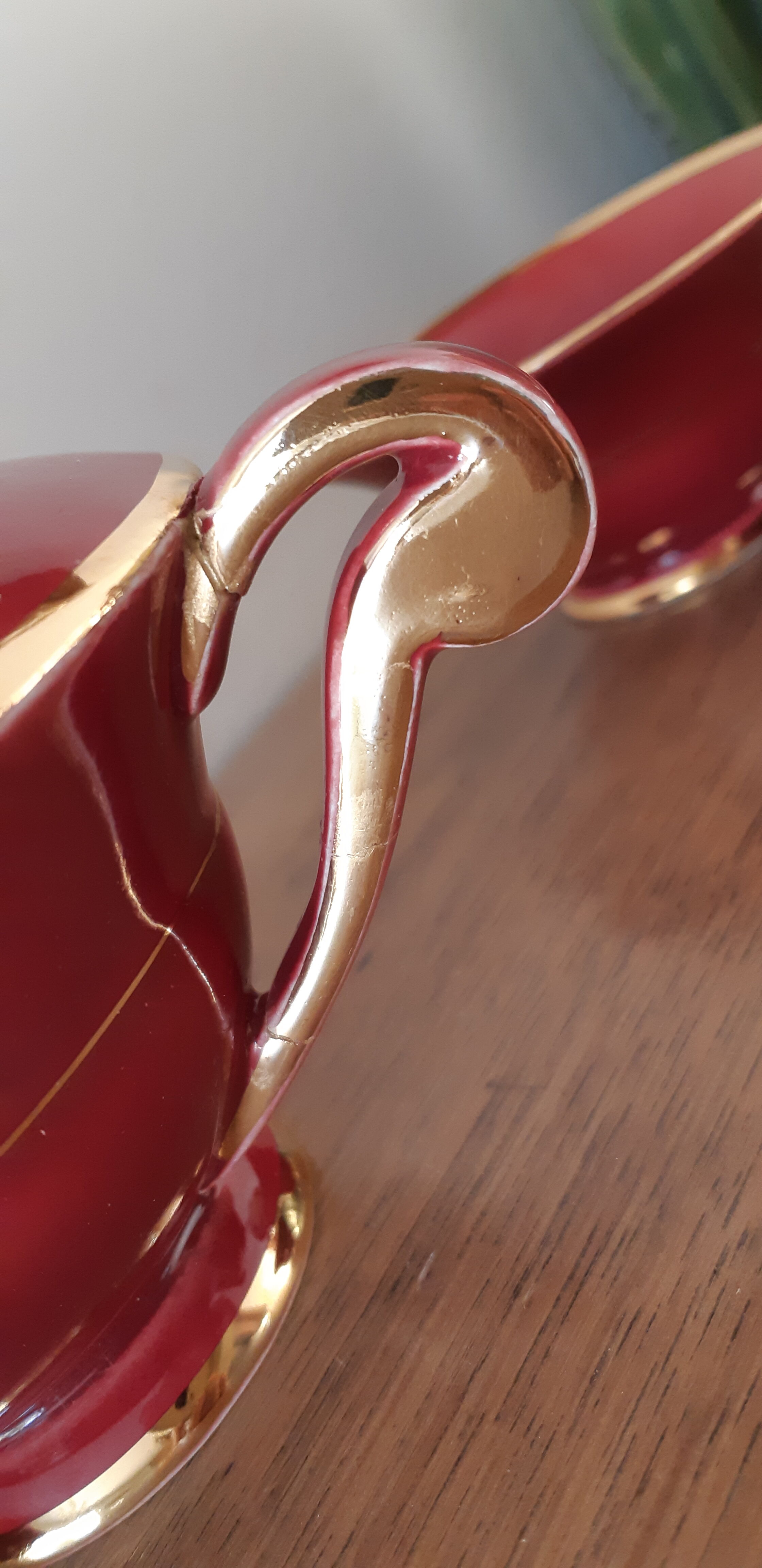 Tea, coffee and sugar cups made of red and gold porcelain