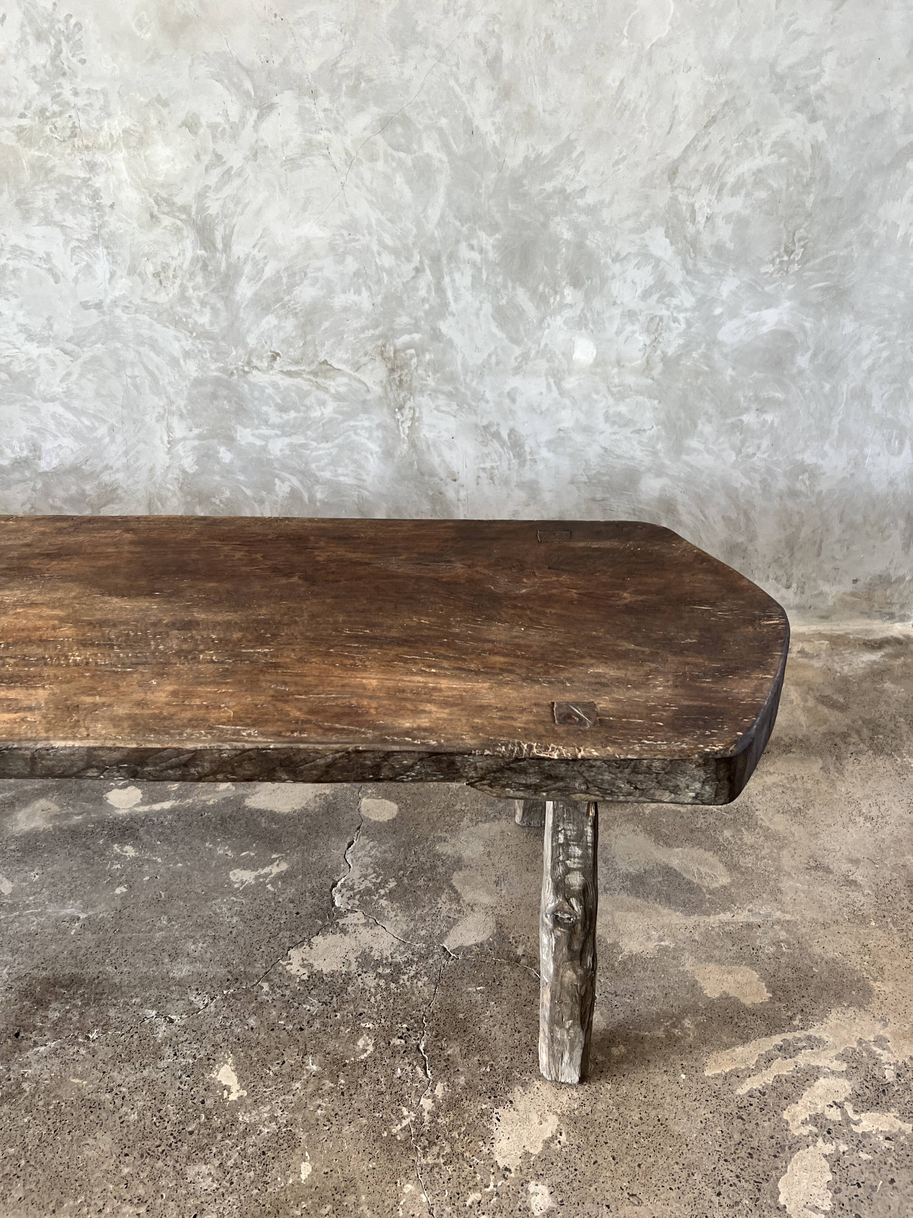 Large rounded coffee table in old Asian teak