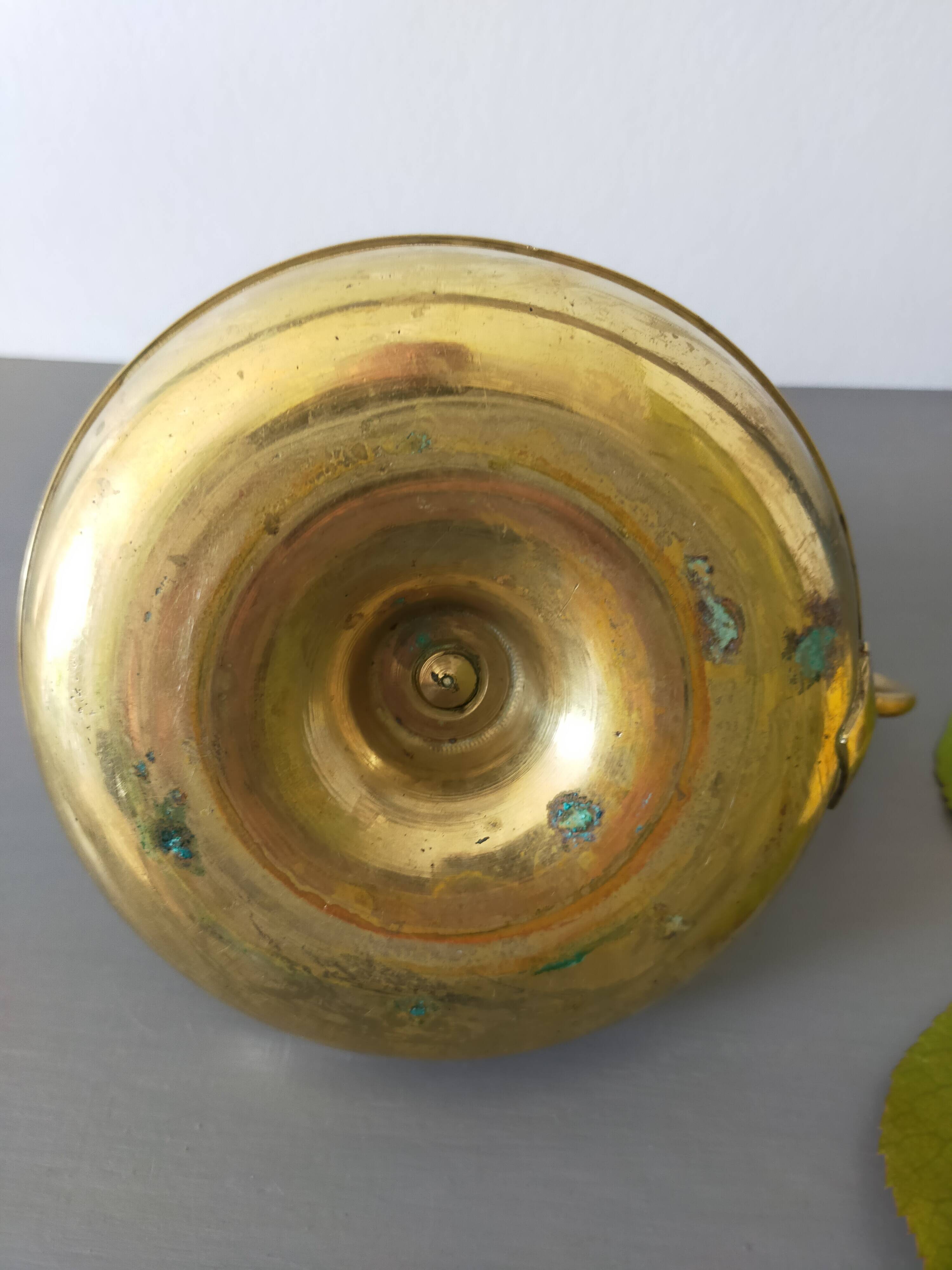 brass candle holder with old cellar rat thumb