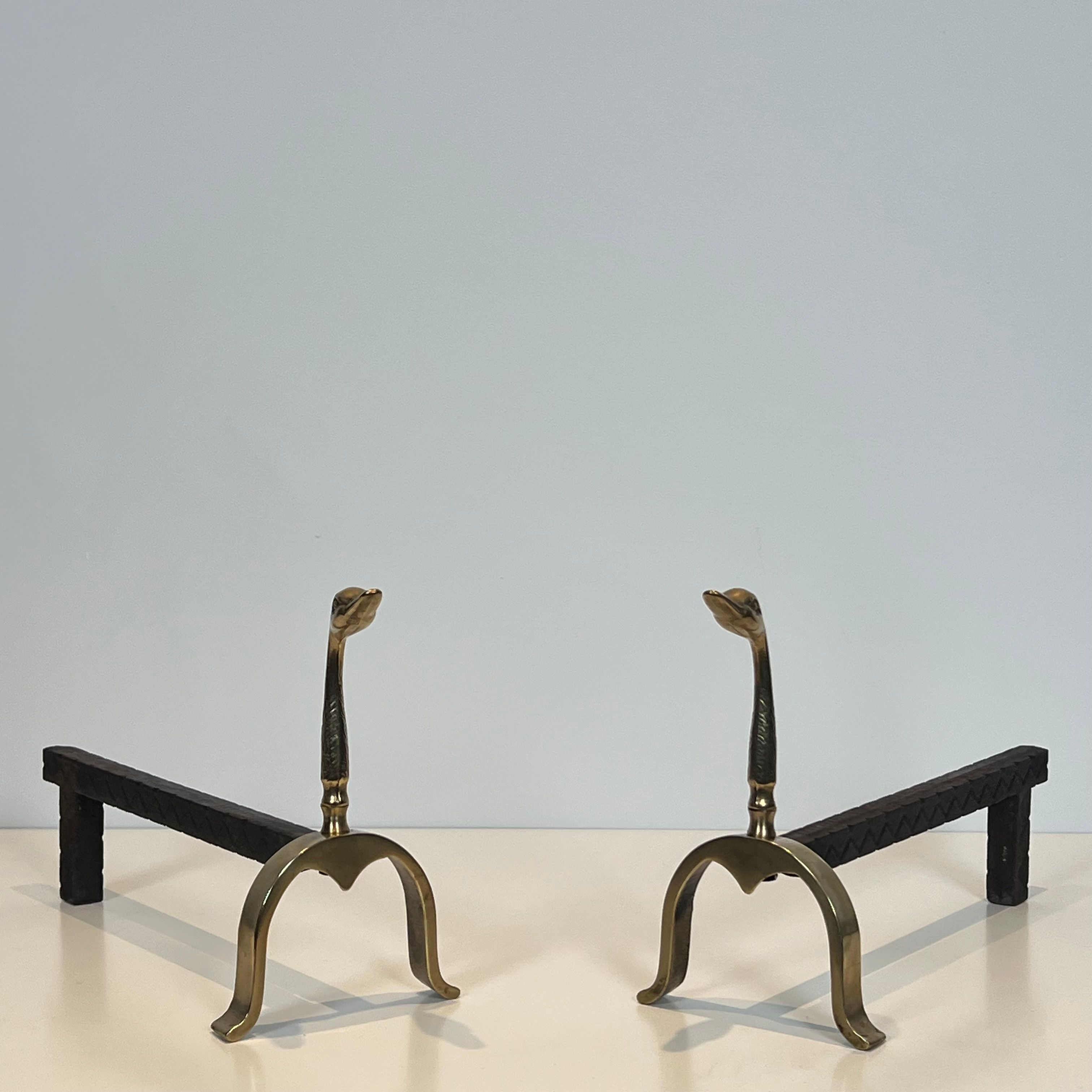Pair of brass andirons with ducks. In the style of Maison Jansen.
