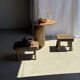 Small stool, square solid teak side table with a curved seat.