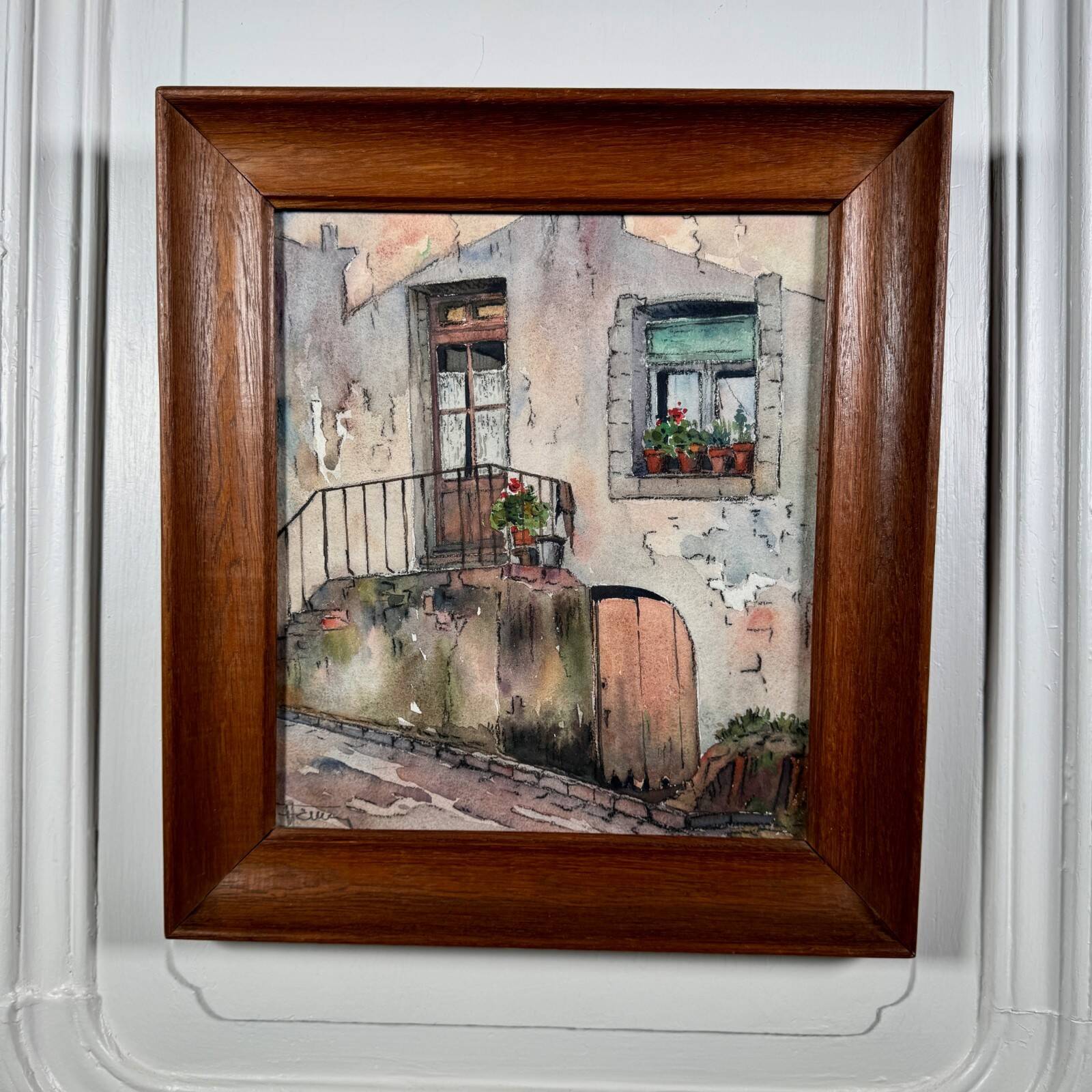 Watercolour on paper depicting the entrance of a house from the early 20th century.
