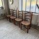 Set of 4 oak and straw chairs Dudouyt 1940