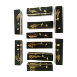 Knife holders in bakelite and gold leaf