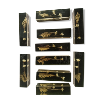 Knife holders in bakelite and gold leaf