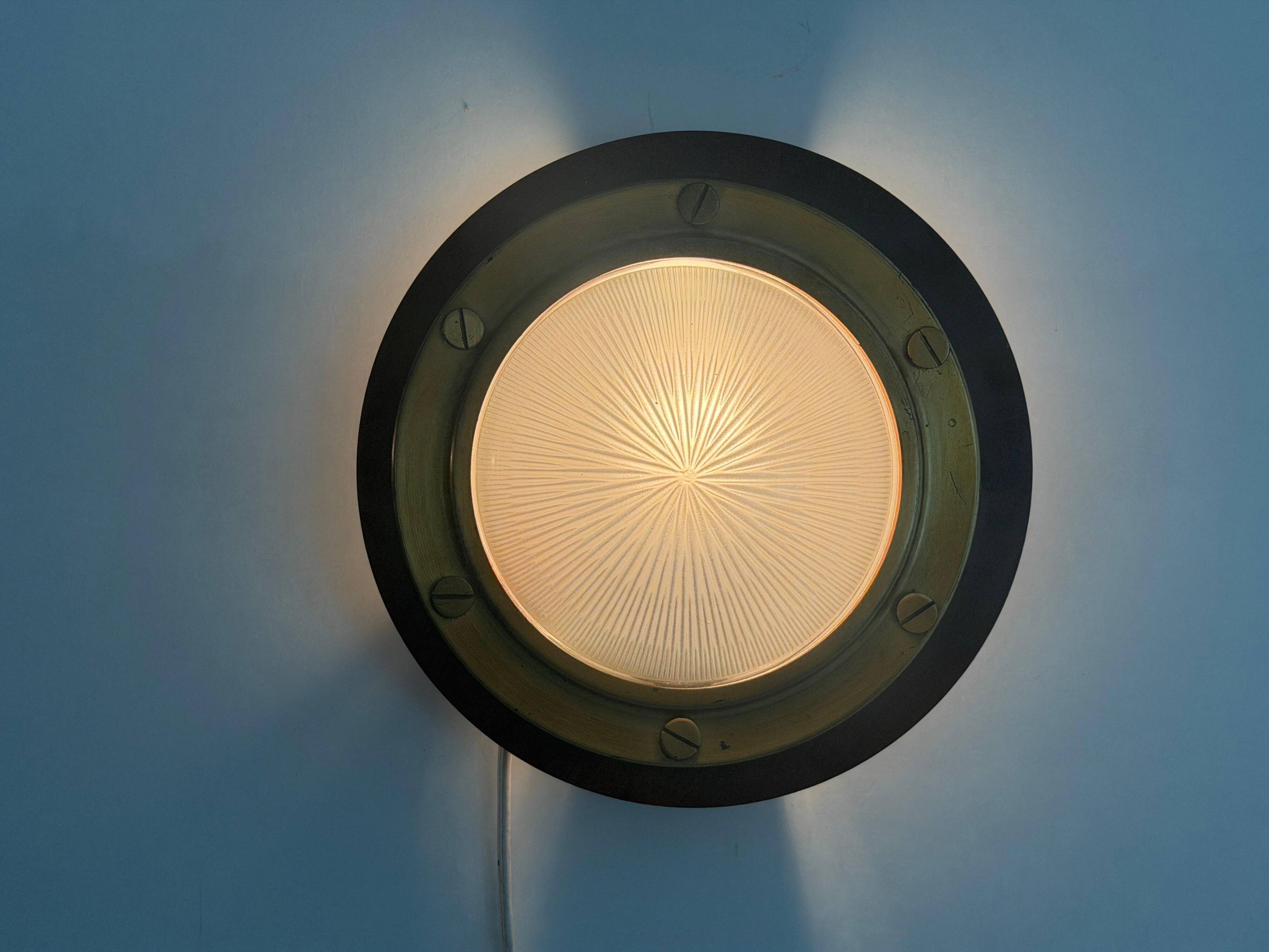 Pair of round glass wall lights, brass base and Wood Wood, 1960s, Italy.