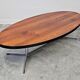 Danish Mid Century Modern oval coffee table with a teak top and chrome legs.