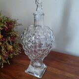 Old carafe in pressed glass grape cluster style