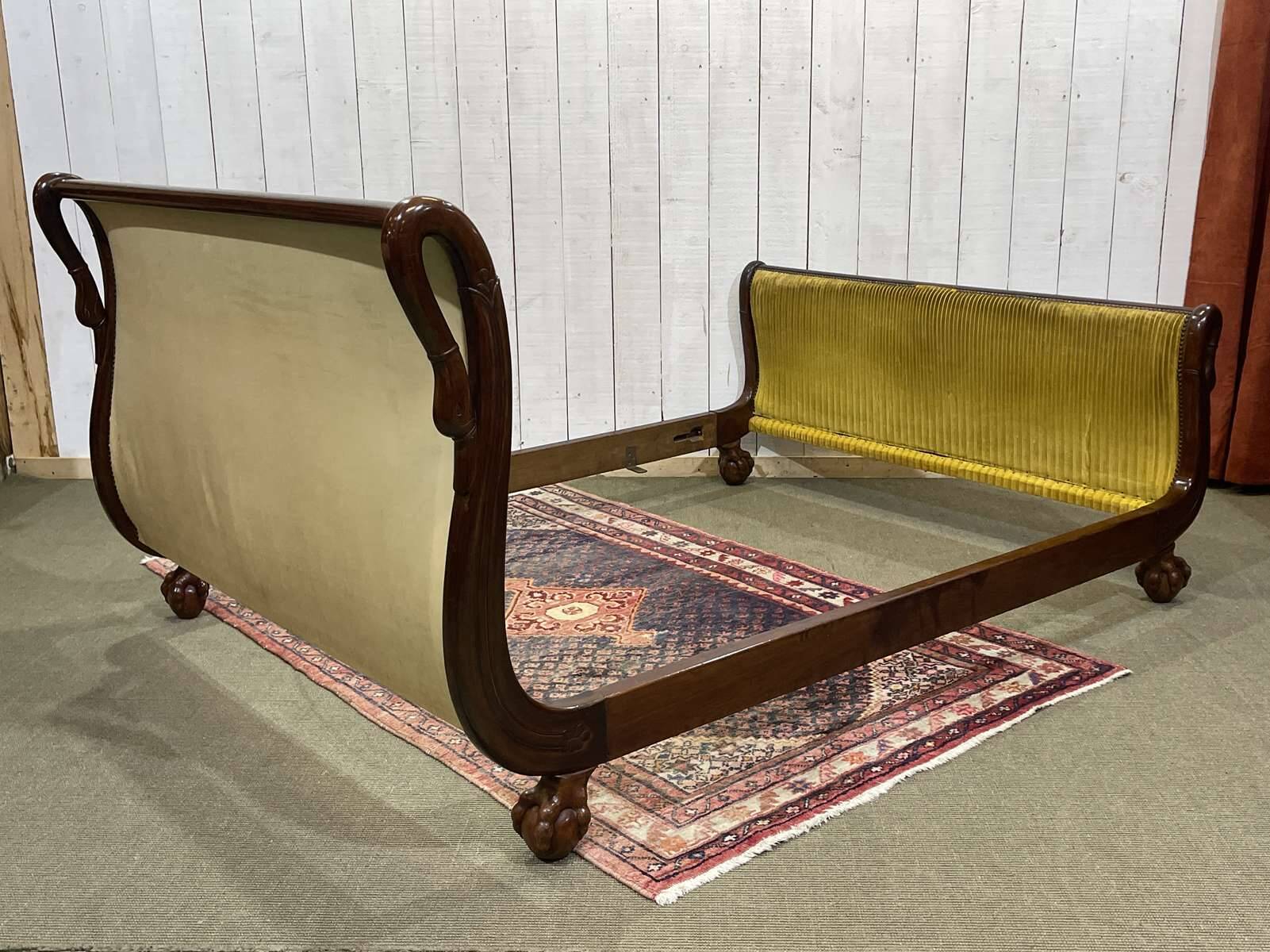 Early 19th century Empire mahogany bed with swan neck finials and claw feet