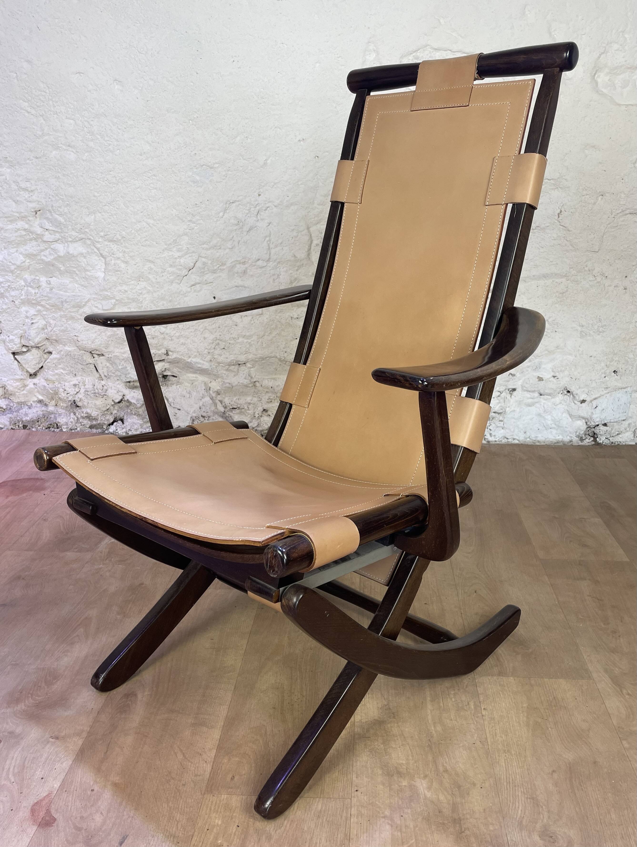 Colonial style leather armchair and ottoman