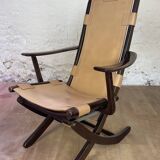 Colonial style leather armchair and ottoman