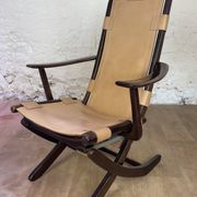Colonial style leather armchair and ottoman