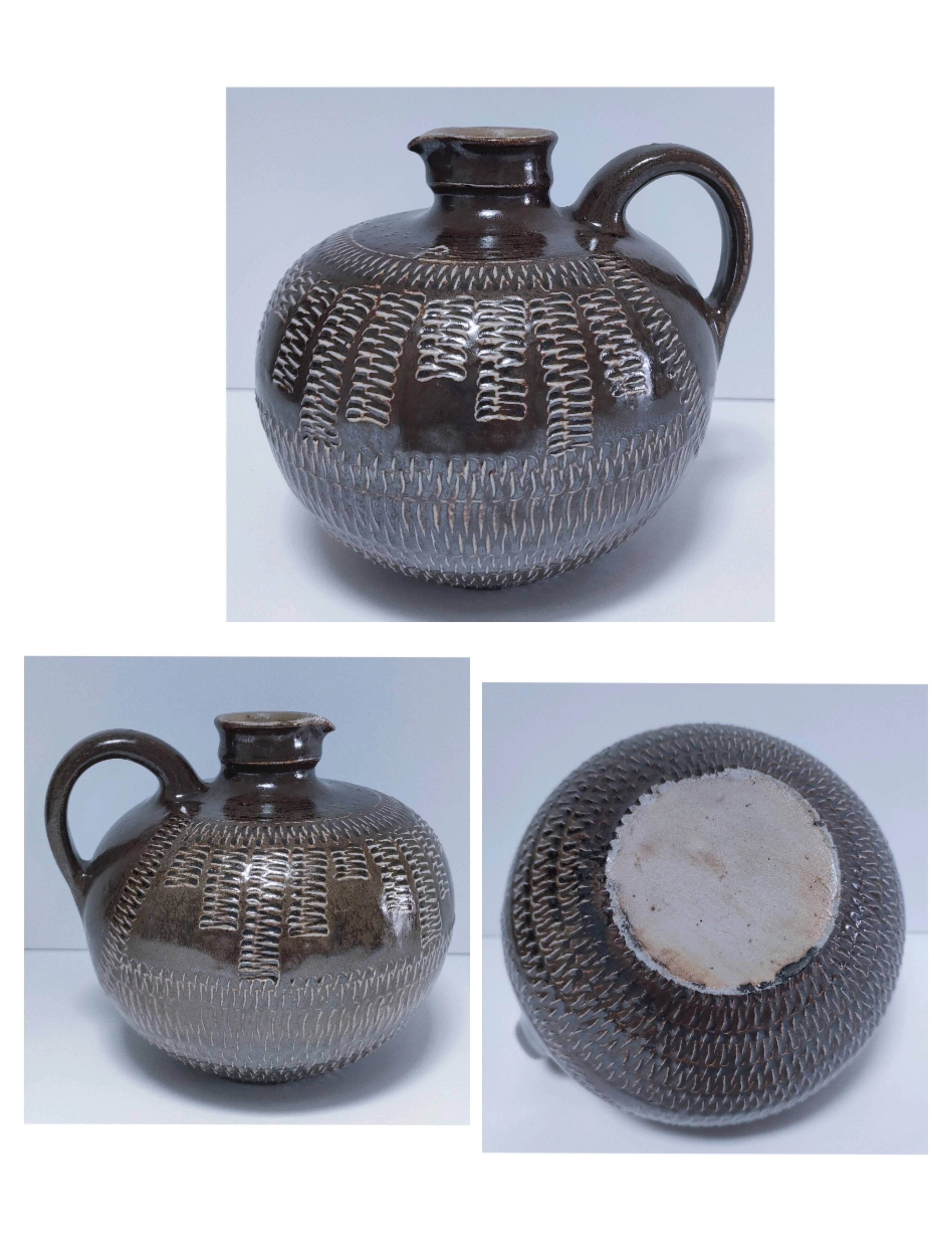 Vintage scarified glazed stoneware pitcher