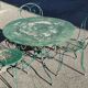 Garden table, two armchairs and a metal chair