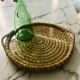Turned wicker tray and vintage glass