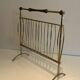 Brass and wood magazine rack, in the style of Cesare Lacca.