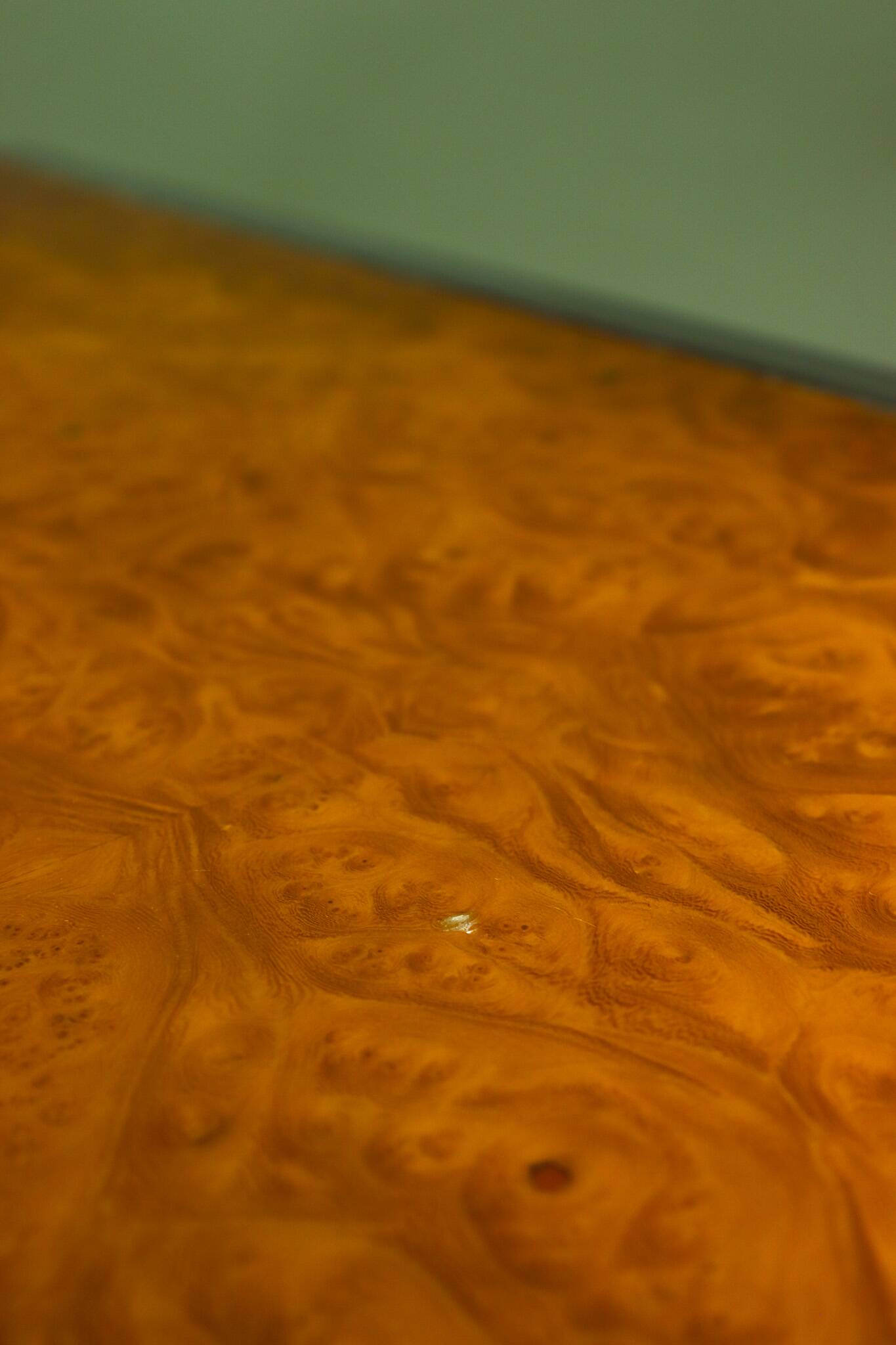 Vintage 1970s coffee table in chrome and burl wood.