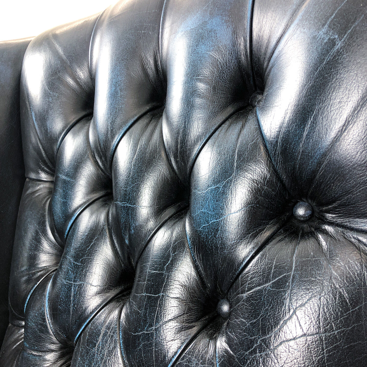 Vintage blue leather chesterfield armchair