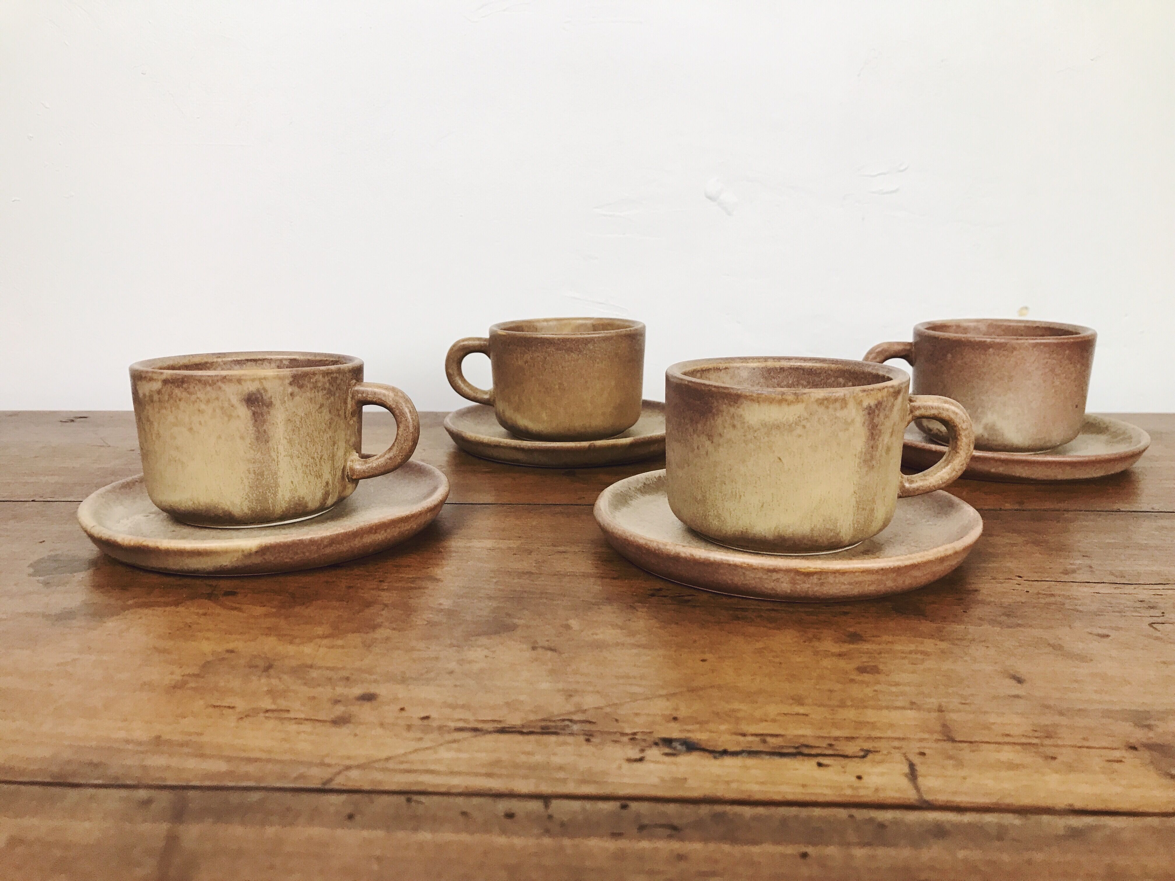 4 sandstone cups with under cups