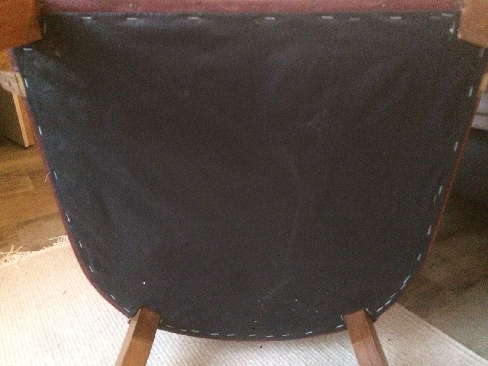 Skai chair binds wine and wooden footpieces and armrests