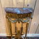 Louis XVI style console in gilded and carved wood