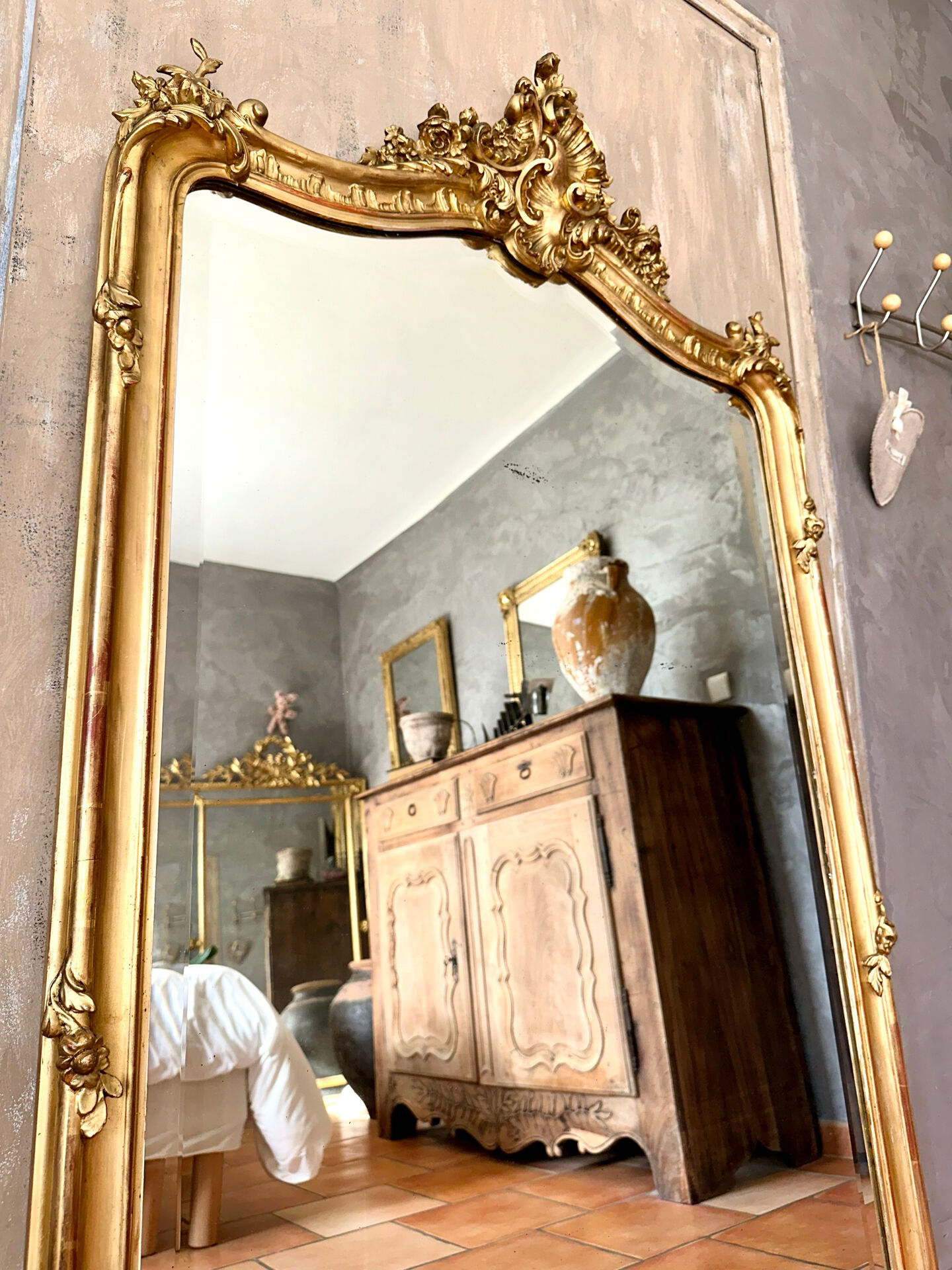 Antique gilded Louis XV pediment mirror