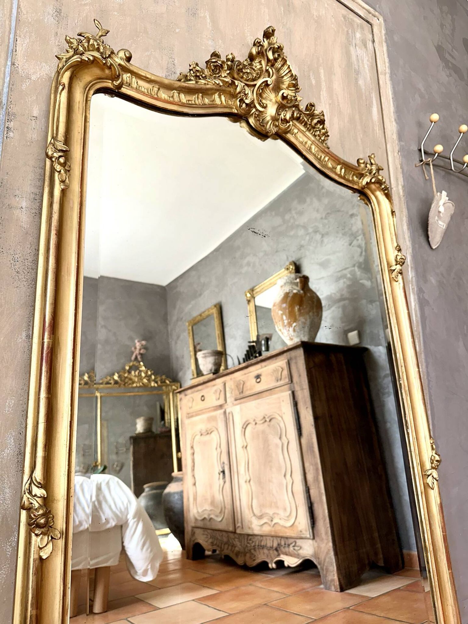 Antique gilded Louis XV pediment mirror