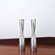 Pair of minimalist aluminium candlesticks in the style of Erika Pekkar.