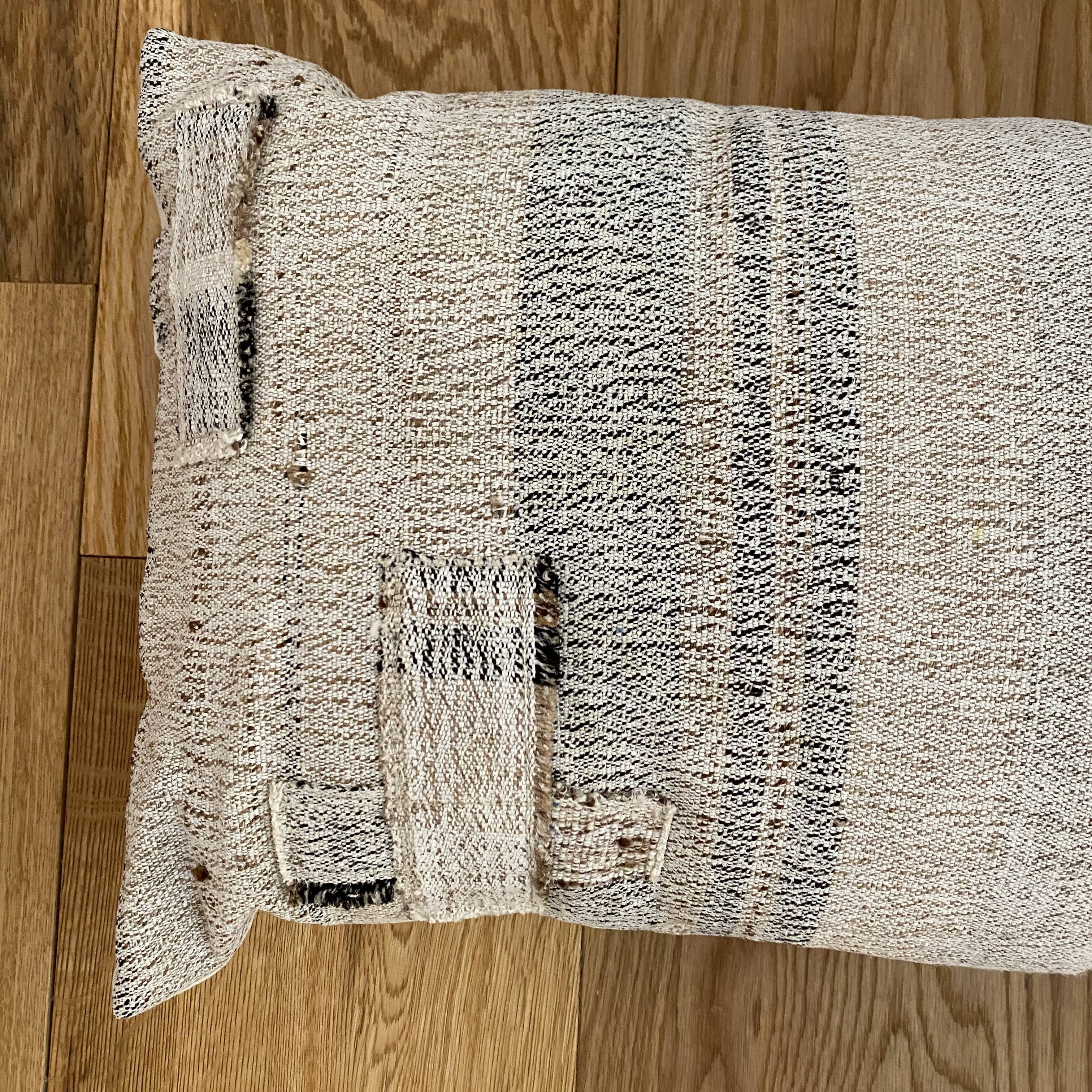 Cushion in vintage woven kilim style, patched.
