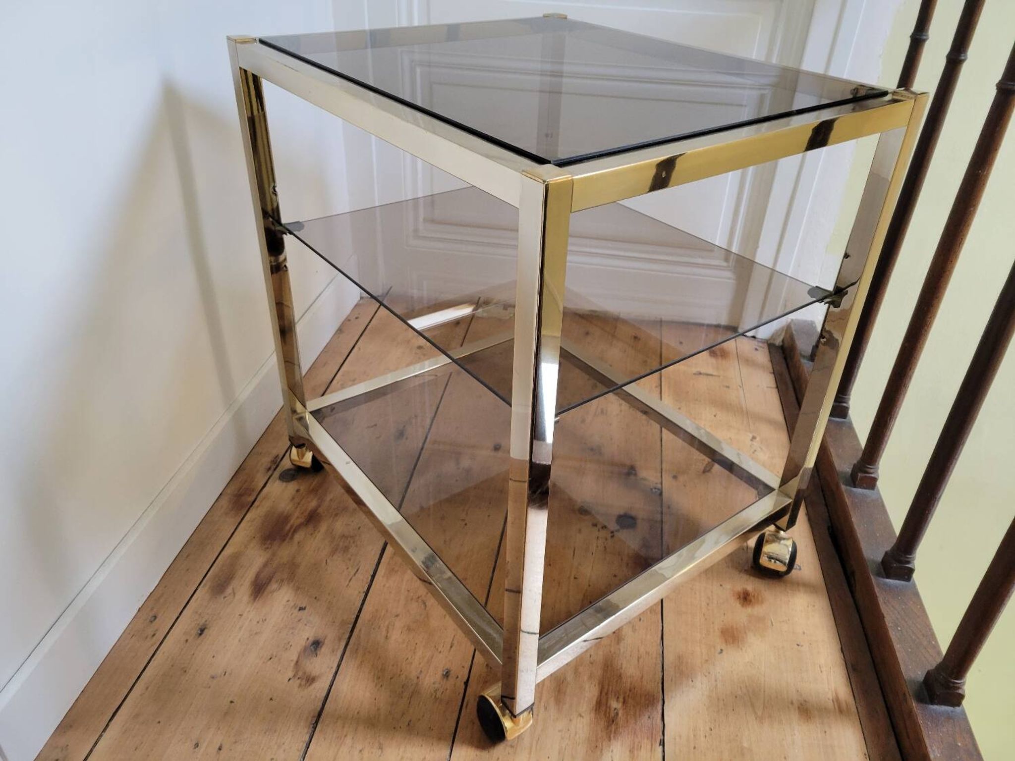 Gold metal and smoked glass serving trolley