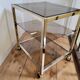 Gold metal and smoked glass serving trolley