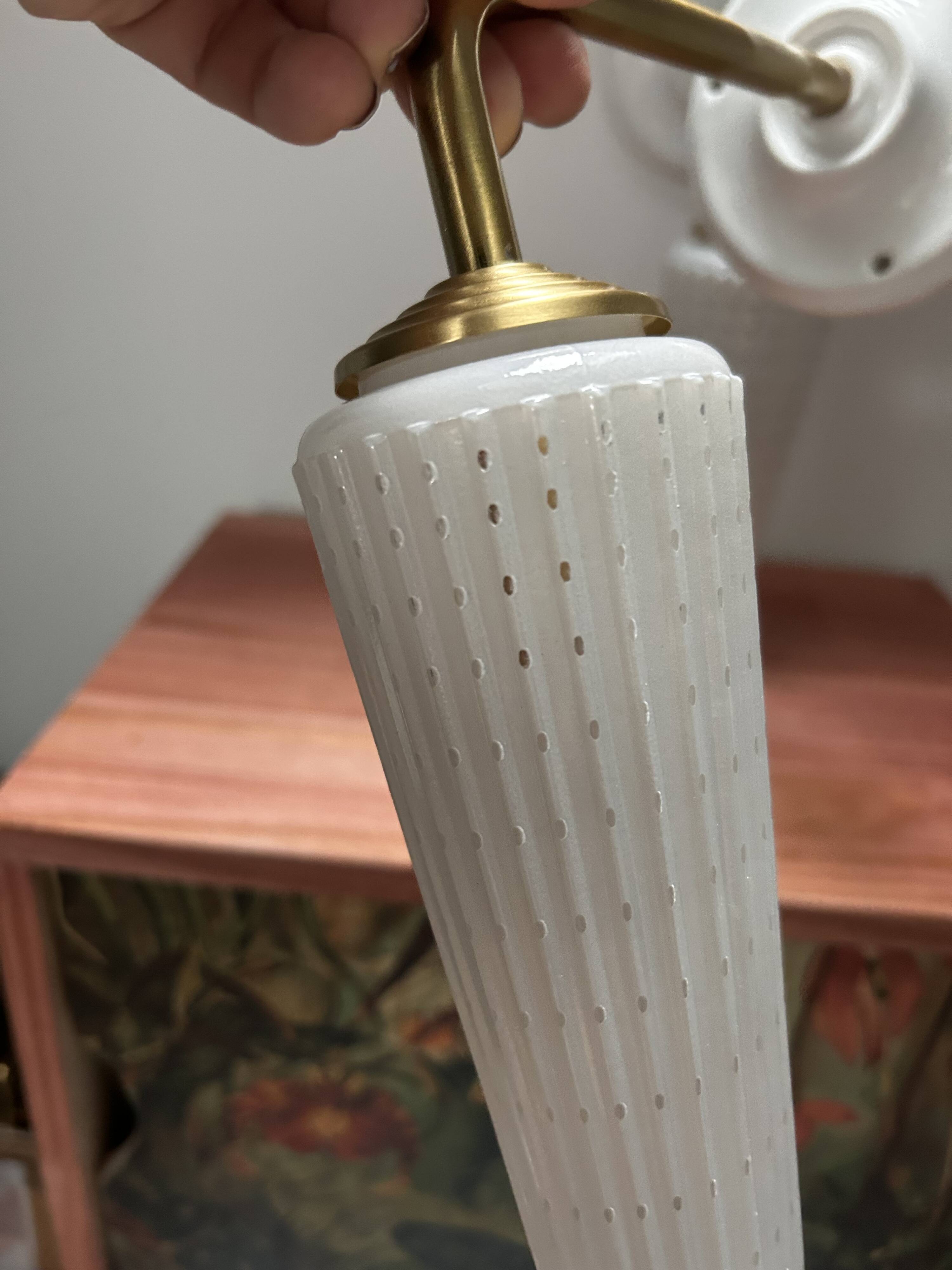 Pair of white and gold wall sconces