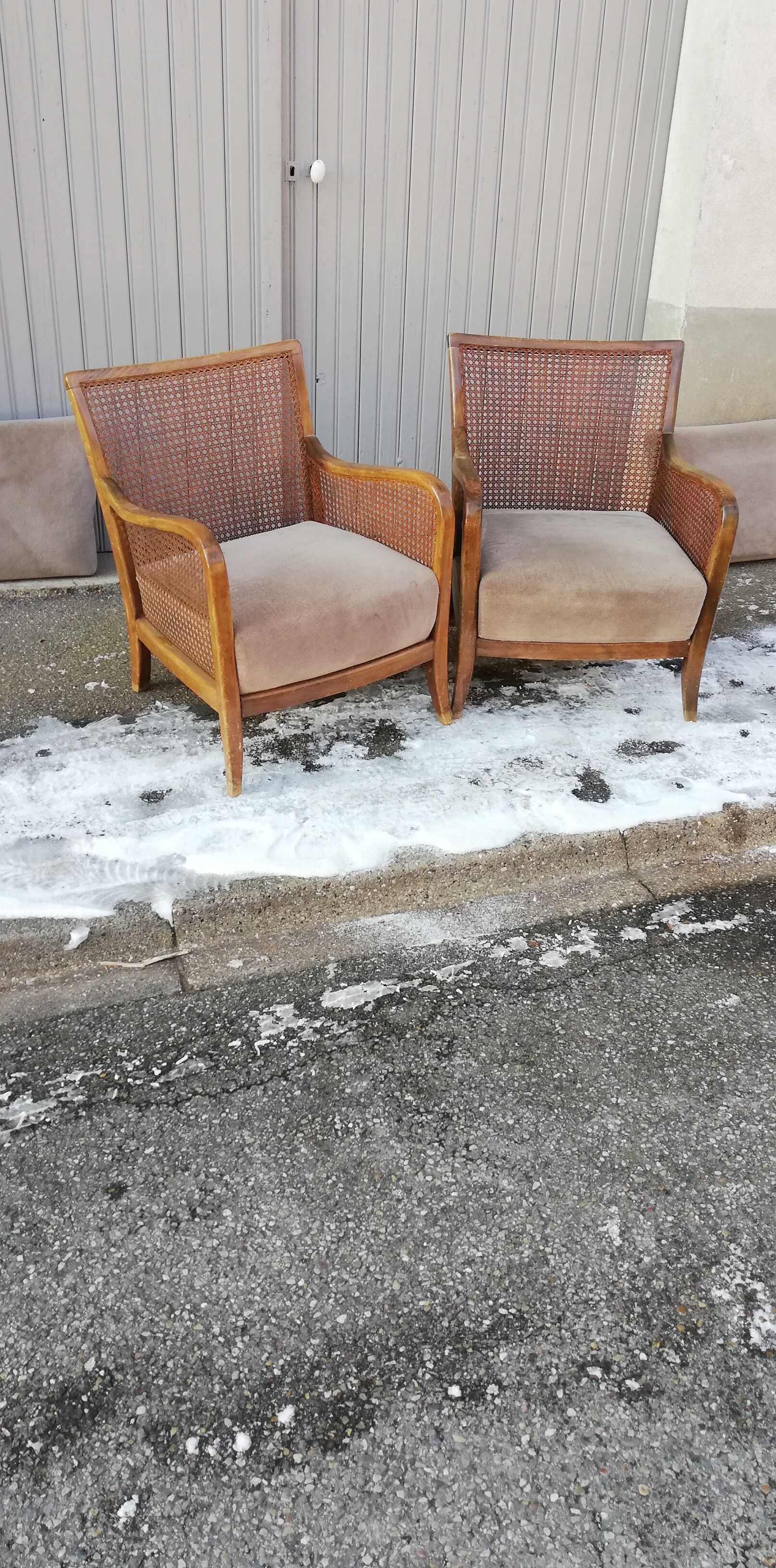 Pair of vintage cannage and fabric armchairs