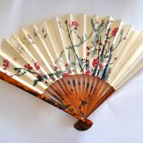 Vintage bamboo fan with floral decoration from China.