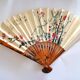 Vintage bamboo fan with floral decoration from China.