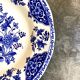 Round and hollow gien dish in white and blue enamelled earthenware