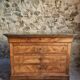 French antique walnut commode with a dark grey marble top, circa 1830–1860.