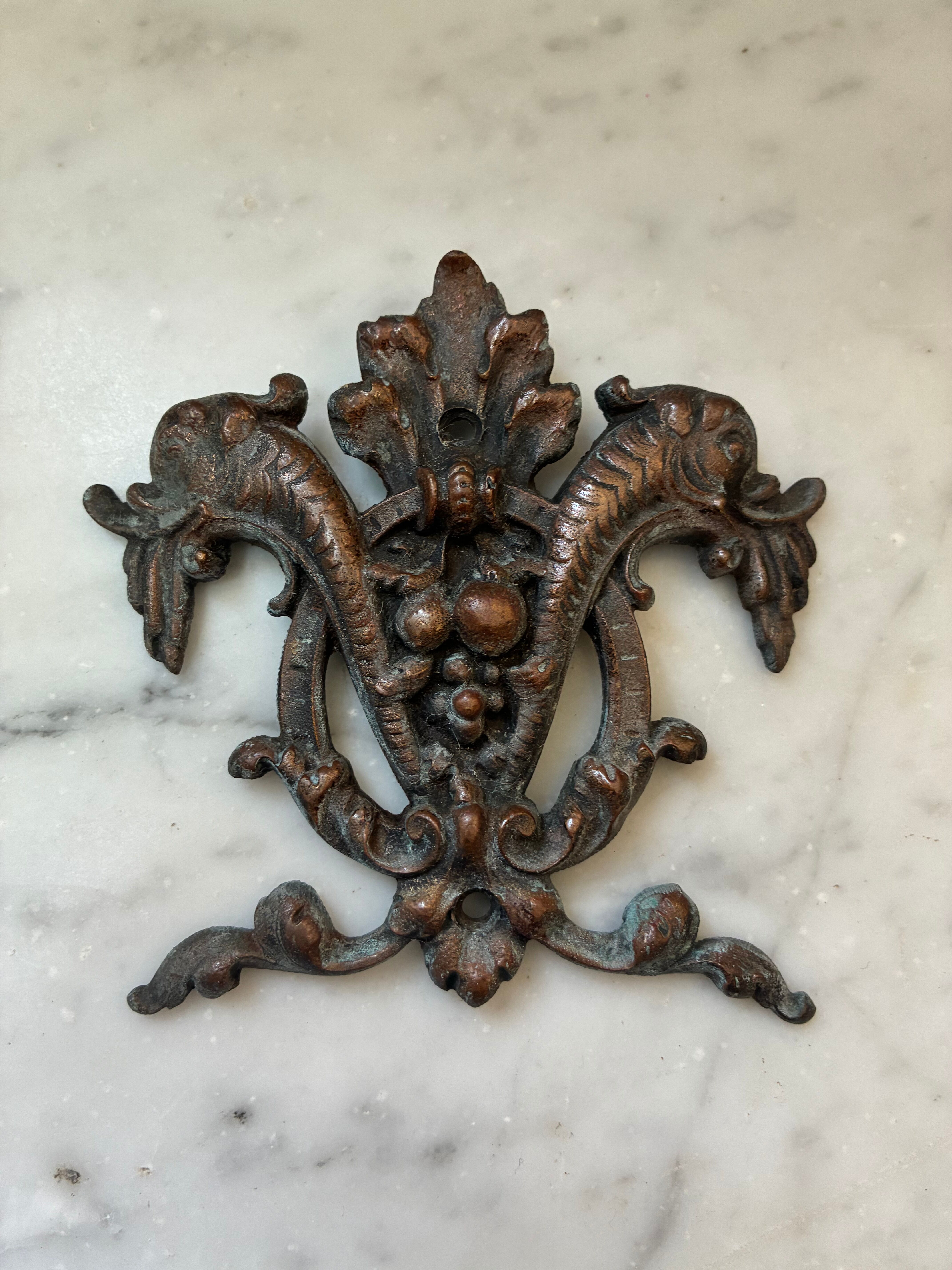 Vintage small furniture ornament in copper alloy with fish decoration.