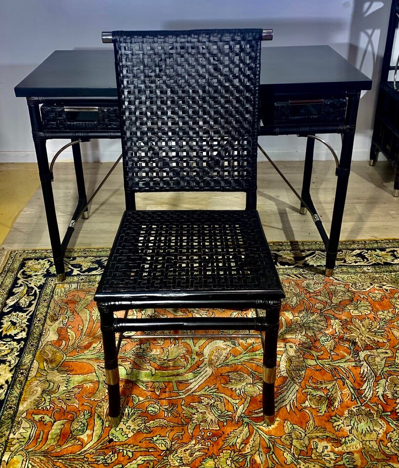 Office with its rattan armchair and brown leather braiding, italian design