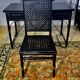 Office with its rattan armchair and brown leather braiding, italian design