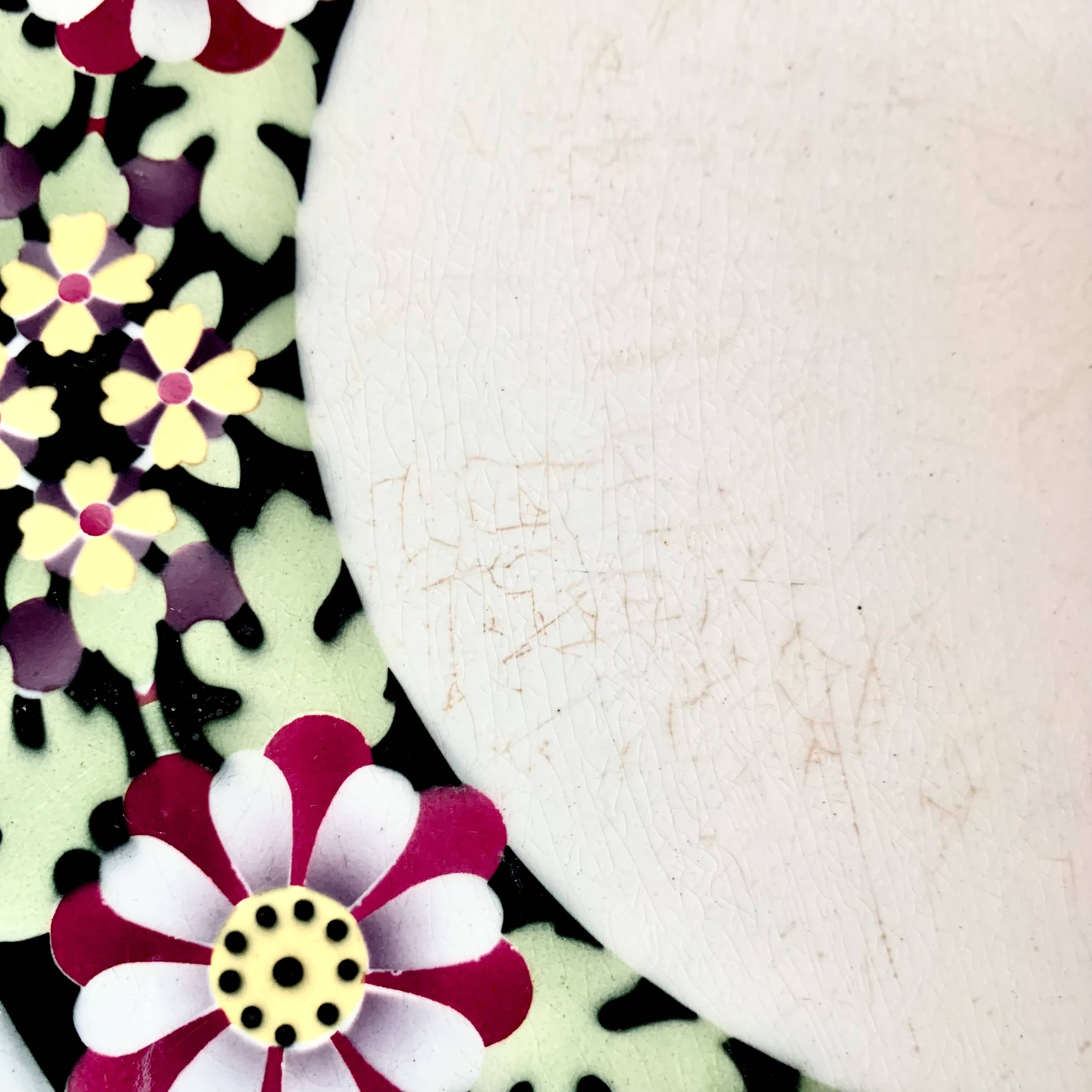 Antique ceramic trivet - floral decoration