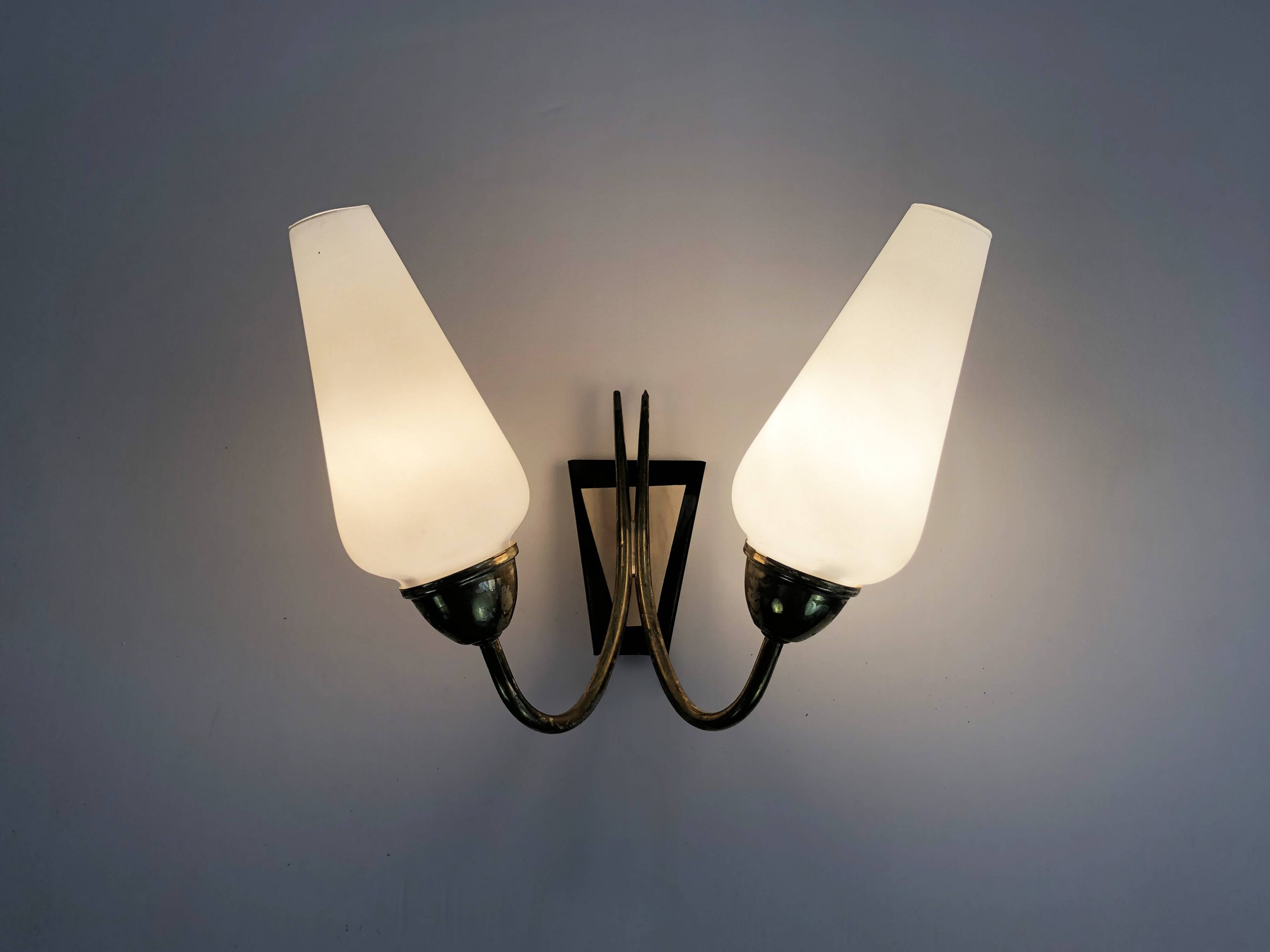 Pair of brass wall lights with double white tube lights. 70s