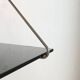 Mid-century vintage shelf in a loop shape, black glass and metal.