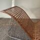 Magazine holder in woven rattan and metal