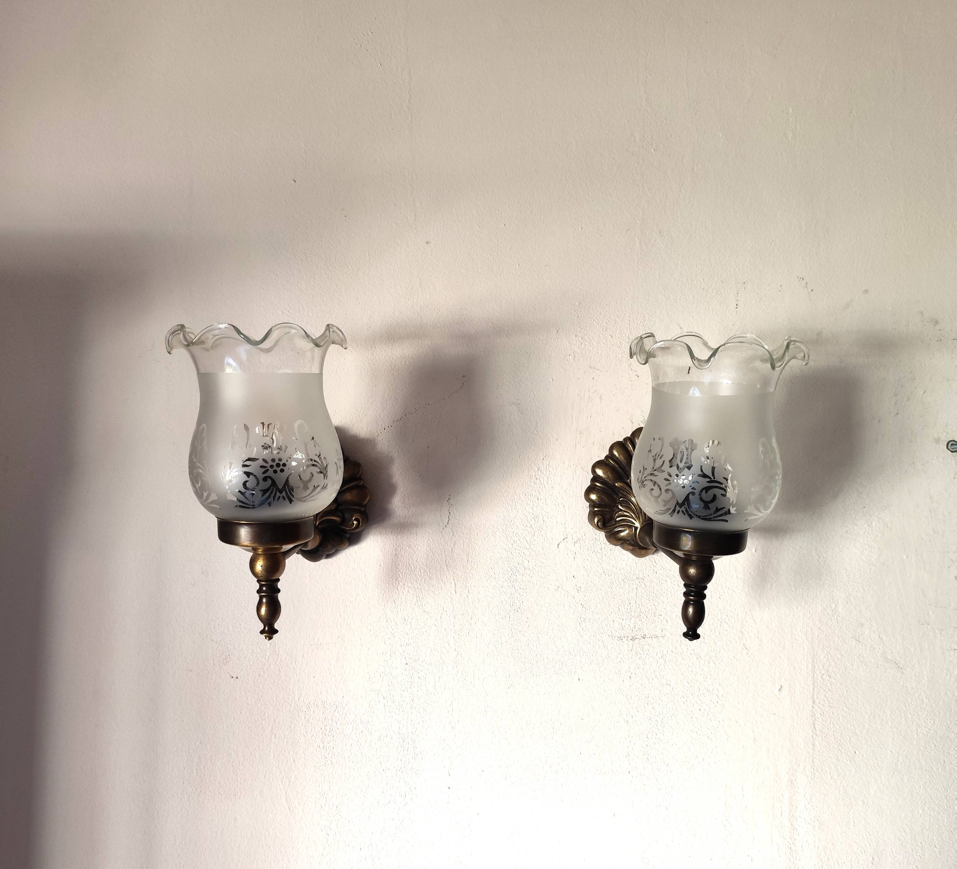 Pair of wall sconces in bronze with opaline glass tulips.