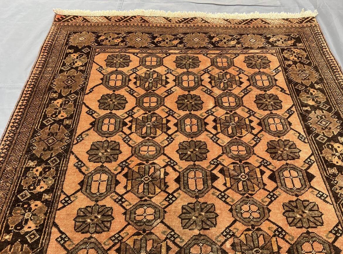 Old faded terracotta rug | Turkmen tribal wool rug