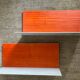 Pair of contemporary wall shelves in steel and stained wood