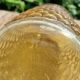 Artisanal blown amber glass vase with integrated honeycomb structure.