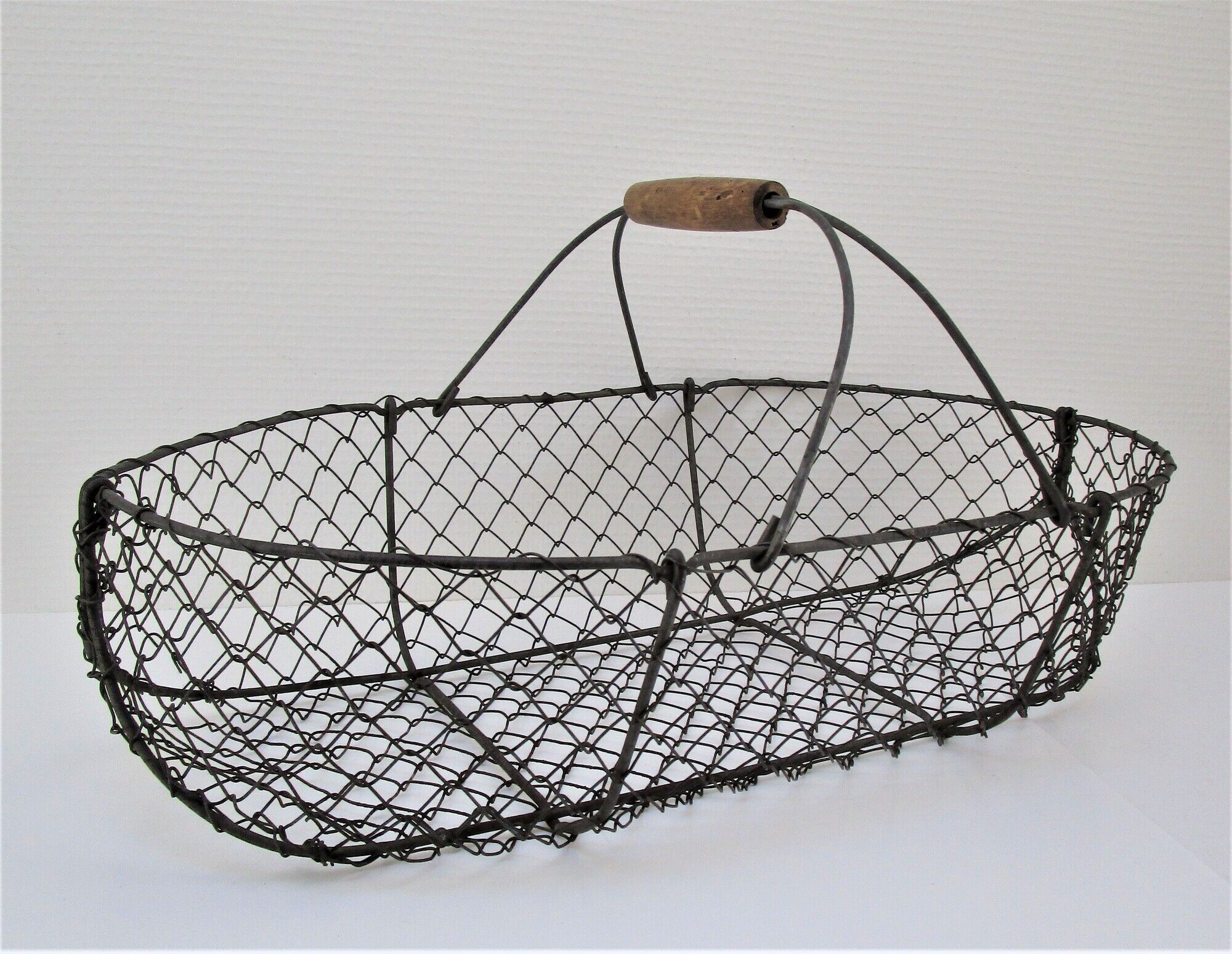 Two baskets metal and patinated wood early twentieth century