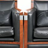 Set of 2 black leather Art Deco design armchairs in good condition